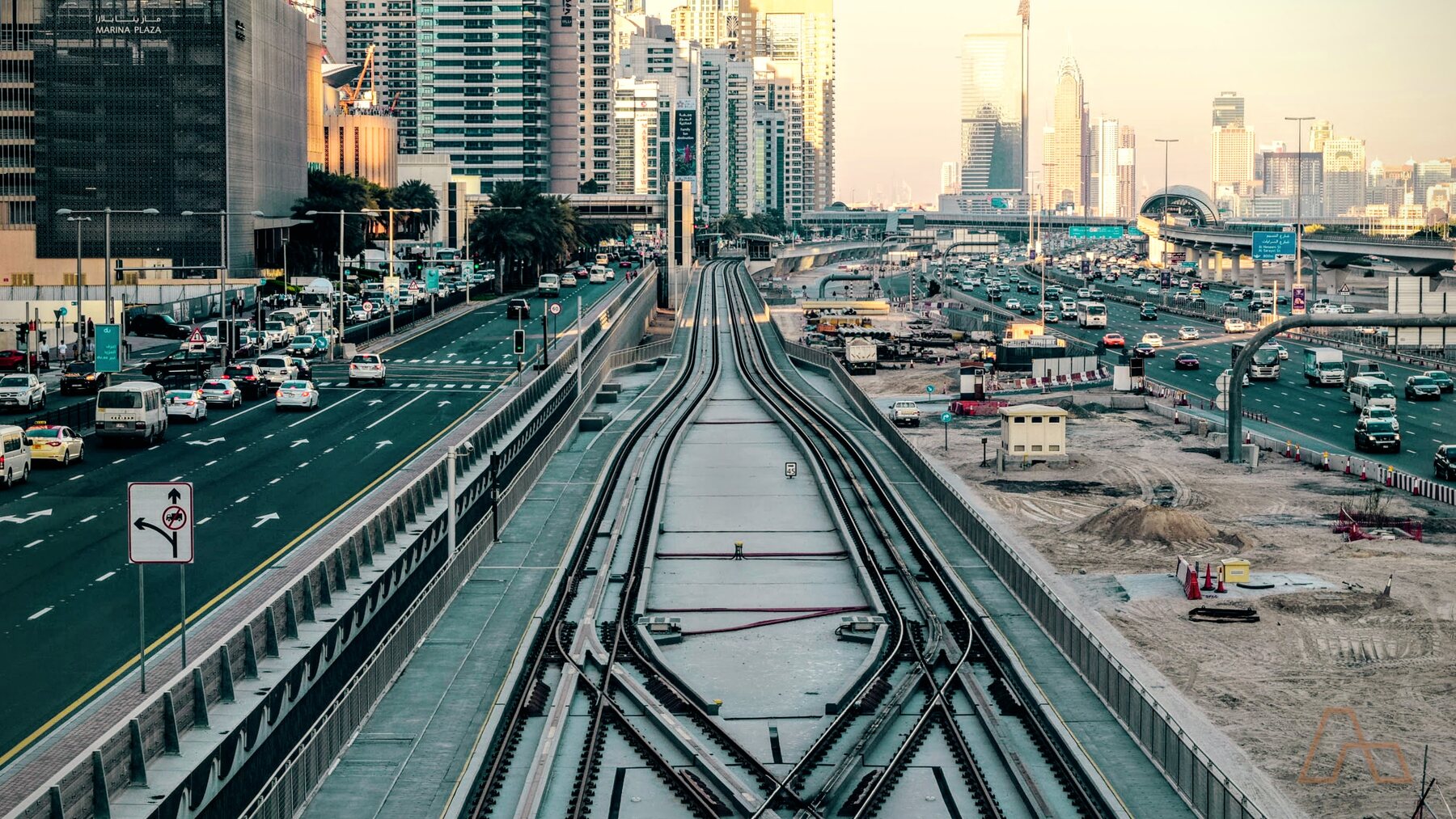 The Dubai Metro line and road corridor running through a residential district