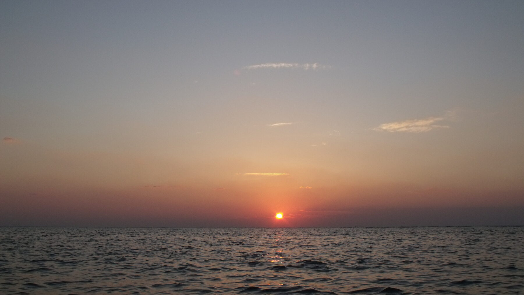 Sunset over the Arabian Gulf, the shoreline Mira Coral Bay faces from Al Mairid