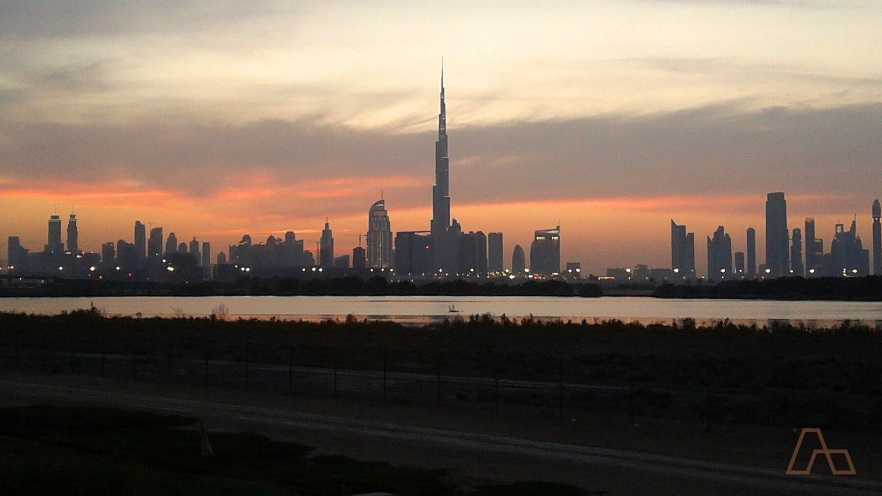 Dubai's skyline seen from the edge of the city, where the entry-level districts are built