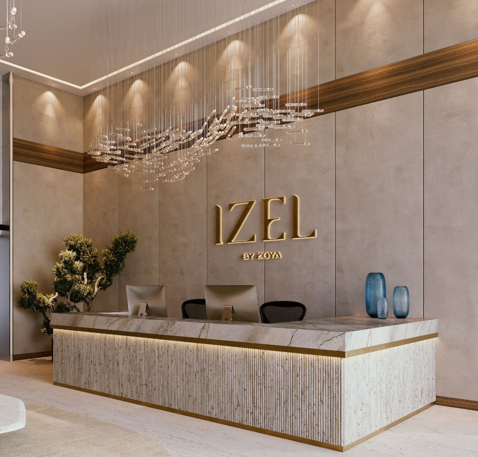 IZEL by ZOYA reception lobby with marble desk and illuminated signage